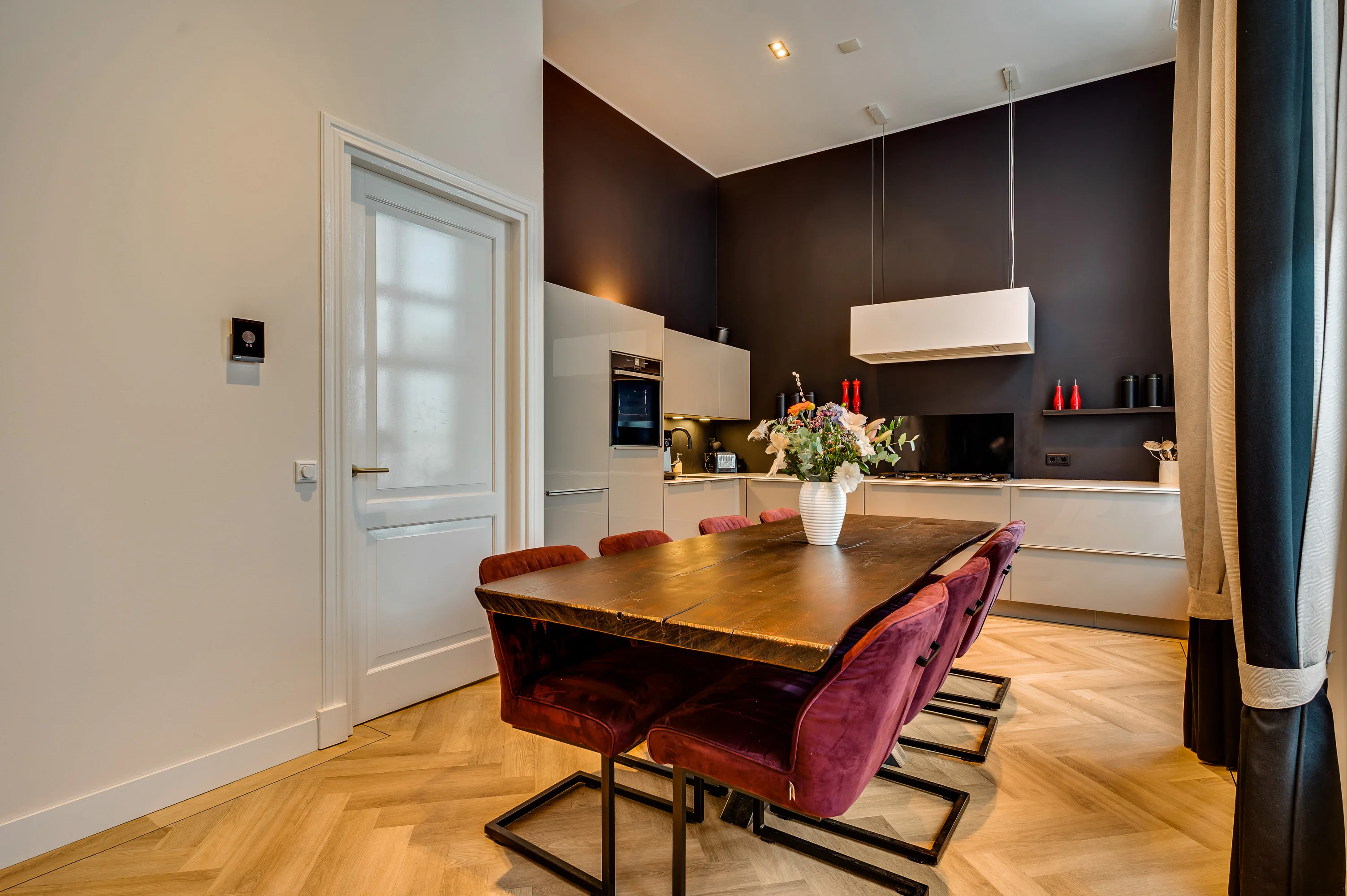 Dining area with red chairs